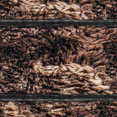 Seamless 4k photo material texture of brown colored disheveled fur with leather black straps.