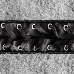 Seamless 4k photo material texture of light gray wool fur with atlas lacing straps.