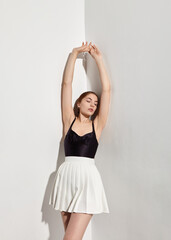 A woman shows off her armpits in stylish summer clothes