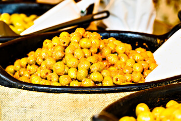 Container with fresh and delicious green olives	