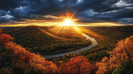 Spectacular sunset over the valley with river winding through colorful autumn trees