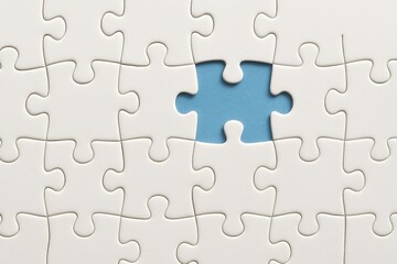 Fototapeta premium Missing Piece in a White Puzzle with Soft Blue Background
