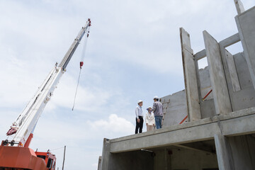 On site at construction site. Building structure. Civil engineer. Team of construction engineer...