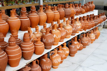 Clay jugs for sale, terracotta jugs on shelf