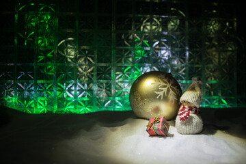 Christmas home decoration with snow and tree on a dark background with copy space. Selective focus. New Year attributes on background