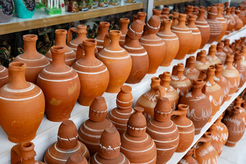 Clay jugs for sale, terracotta jugs on shelf