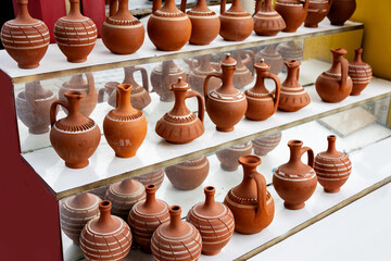 Clay jugs for sale, terracotta jugs on shelf