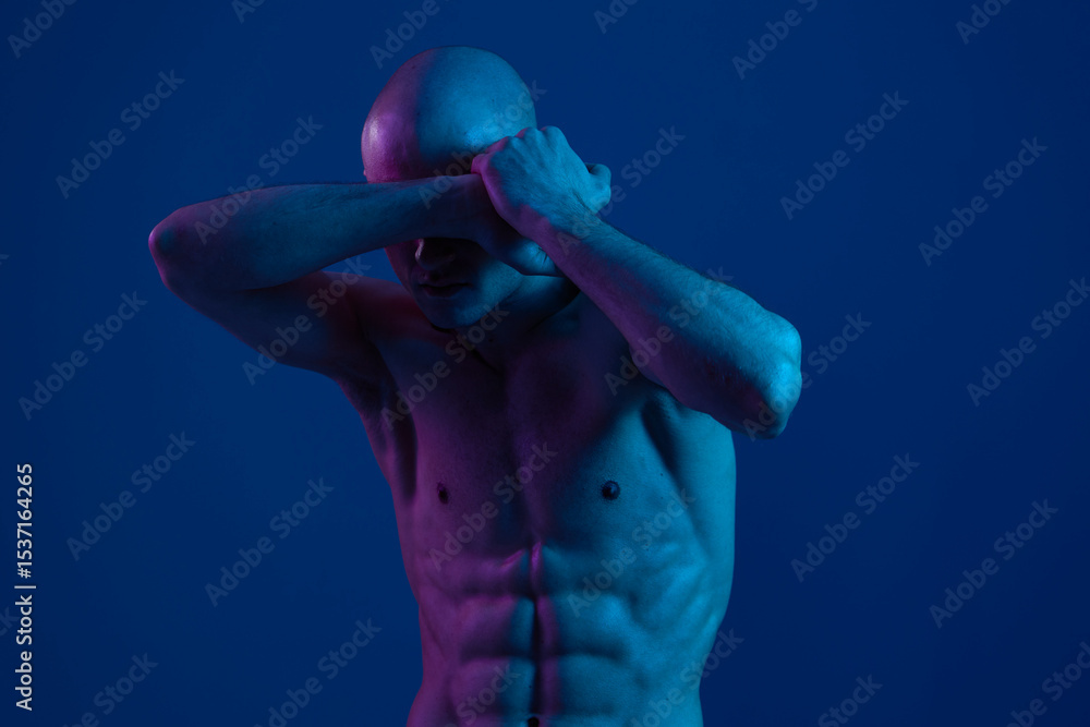 Poster man covering his eyes with hands, expressing vulnerability and introspection. the image captures a d