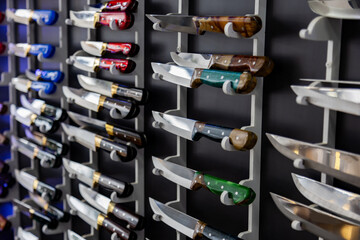 Set of knives on a shelf in a shop. Close-up.