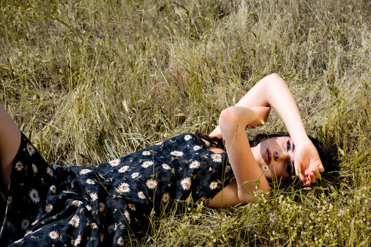 Brunette female 19 years old posing outdoor as fashion model