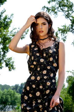 Brunette female 19 years old posing outdoor as fashion model