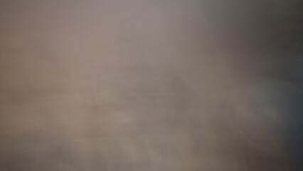 The image is quite blurry and lacks distinct elements, making it difficult to describe in detail. It appears to have muted colors that blend together, creating an abstract and indistinct composition.