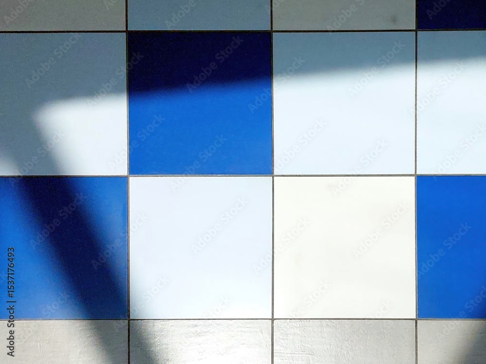 Aufkleber Colored Tiles Creating Patterns on the Floor With Fascinating Shadows in Natural Light