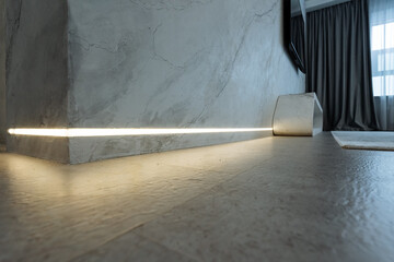 The room features a beautifully crafted wooden floor and a softly lit wall, creating a warm,...