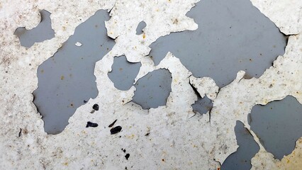 Peeling Paint Texture Revealing Layers of Gray and White on a Weathered Surface
