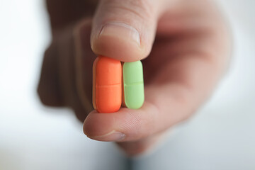 a lot of pills in the palm of a person's hand, medical background