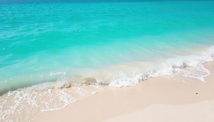 Serene turquoise ocean water laps gently against a pristine sandy shore, creating soft waves and a tranquil atmosphere Perfect for travel, nature, and relaxation themes , foam, turquoise