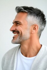 Obraz premium Classy men's hard part haircut - midlife middle eastern man with short hair. Conceptual art of style for aging men. Pure white solid background. A trendy and poised male showing charm.