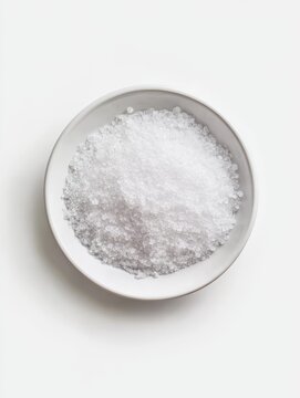 Potassium nitrate (KNO3) in a plate on a solid white background