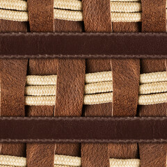 Seamless 4k photo texture material of brown leather pattern with ropes insert and straps.