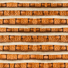 Seamless 4k photo texture material of brown leather with braided elemets and ropes.