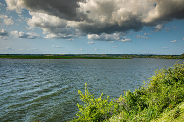 Beautiful natural landscape in the north of the Republic of Moldova with the Prut River and steep cliffs.