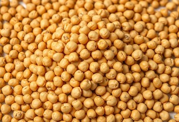 A mound of dried chickpeas, beige and speckled, still life, pulses