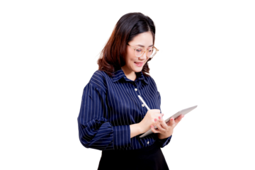 A woman wearing glasses and a striped shirt is smiling while writing or drawing on a digital tablet with a stylus.