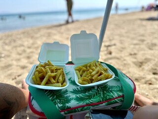 Delicious Potato Chips take away meal enjoyed on the beach