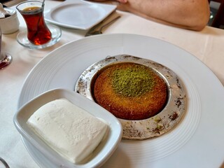 Middle eastern sweets kunefe kunafa kadayif with pistachio Turkish arabic traditional dessert