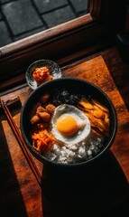 Delicious Bowl of Rice with Fried Egg and Colorful Side Dishes in Natural Light