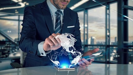 Businessman in modern office interacting with holographic projection of planet earth, showcasing global network and data connections, visualizing international business and technology