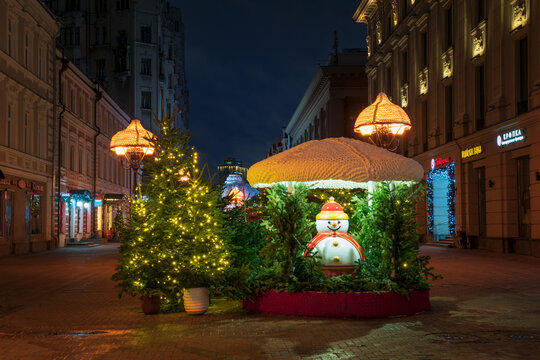 Moscow, Russia, January 02, 2025: New Year's Eve composition on Stary Arbat Street in festive decoration in the early winter morning