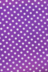 Purple and white polka dot pattern background