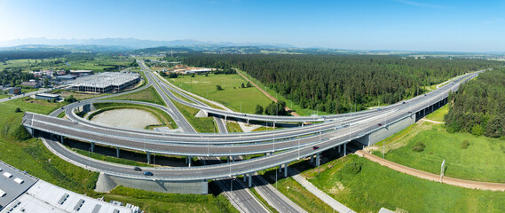 End of new Zakopianaka highway in Nowy Targ, Poland. Interchange with old road from Krakow to Zakopane. State in 2025. Far foggy view of Tatra mountains. Wide aerial panorama. Continuation planed