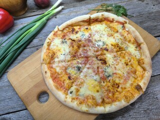 the pizza lying on the table is a top view. High-quality photo