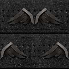 Seamless 4k photo texture material of black leather perforated straps with wing decorations.