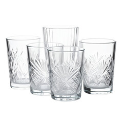 Arrangement of clear crystal glasses with intricate geometric patterns on transparent background