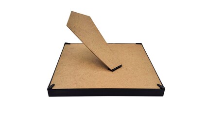 Image of a photo frame flipped over, isolated on white background. Conceptual photography.