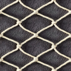 Seamless 4k photo texture material of cloth rope braided net mesh on gray leather surface.