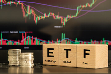 Symbol ETF, acronim Exchange Traded Fund, Business and financial concept. Wooden cubes with an ETF...