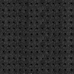 Seamless 4k photo texture material of perforated black colored leather surface.