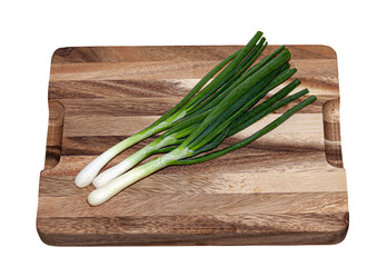 Fresh green onions on cutting board