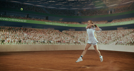 Woman tennis player playing tennis in professional tennis stadium.