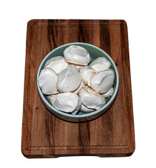 Meringue cookies on a wooden board. Sweet cookies made from eggs and sugar.