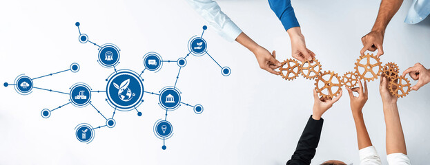 A modern workspace depicting collaboration in business, featuring hands joining gears to symbolize...