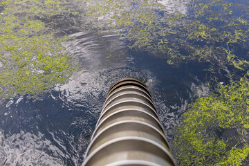 Archimedean Screw Pump Moving Water in Traditional Dutch Drainage System