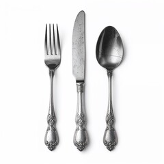 Elegant vintage cutlery set including fork, knife, and spoon on white background