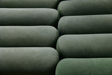 Minimalist upholstered textured, soft green cylindrical pattern, close-up