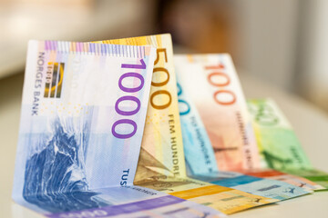 Norway money. Norwegian krone lying on the table. Financial and economic concept